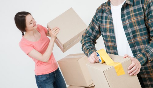 Professional movers handling a flat move in Addiscombe with stairs and careful lifting