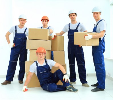 Professional movers handling household furniture in a Croydon flat