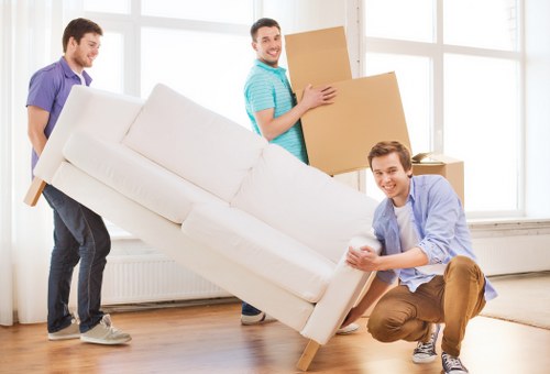 Removal van and movers handling a local house move