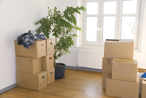 Moving helpers carrying furniture from a flat in Addiscombe
