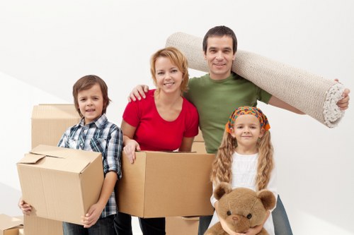 Organised moving day setup with boxes, furniture, and packing materials