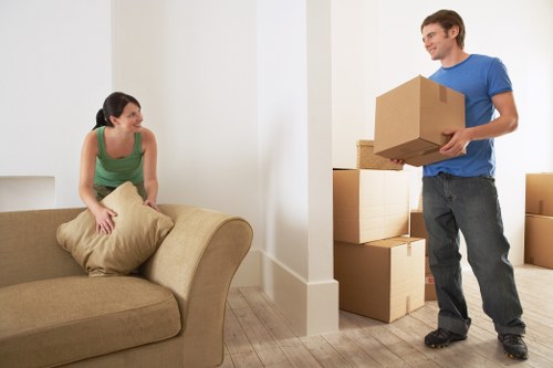 Local moving team handling boxes and furniture for an Addiscombe home